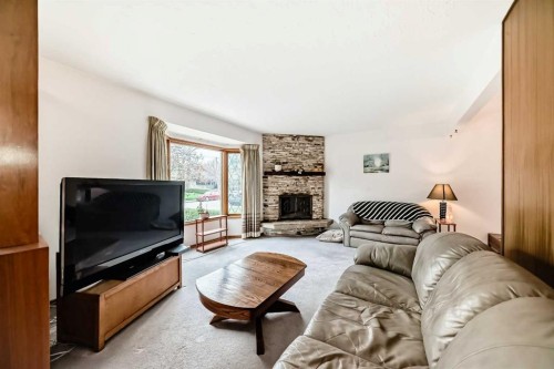 3132 48 Street Sw, Calgary, AB - Indoor Photo Showing Living Room With Fireplace