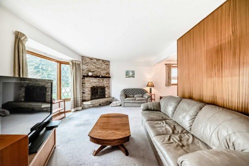 3132 48 Street Sw, Calgary, AB - Indoor Photo Showing Living Room With Fireplace