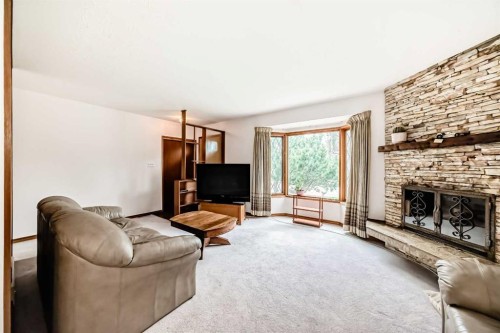 3132 48 Street Sw, Calgary, AB - Indoor Photo Showing Living Room With Fireplace