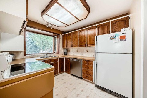 3132 48 Street Sw, Calgary, AB - Indoor Photo Showing Kitchen With Double Sink
