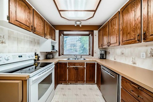 3132 48 Street Sw, Calgary, AB - Indoor Photo Showing Kitchen With Double Sink