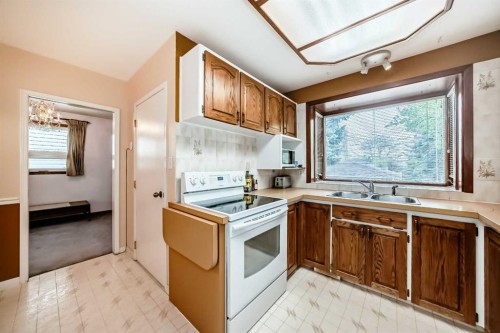 3132 48 Street Sw, Calgary, AB - Indoor Photo Showing Kitchen With Double Sink