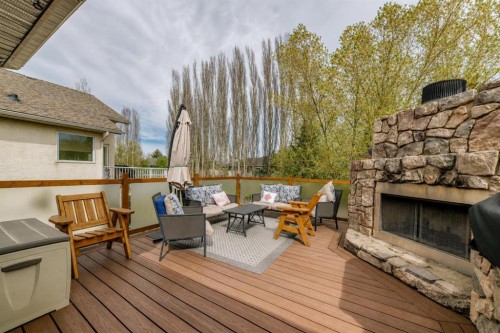 260 Westchester Way, Chestermere, AB - Outdoor With Fireplace With Deck Patio Veranda With Exterior