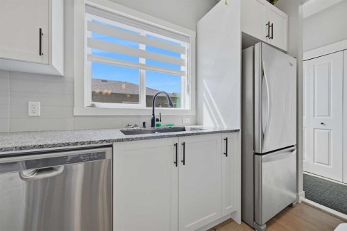 341 Midtown Gate Sw, Airdrie, AB - Indoor Photo Showing Kitchen With Upgraded Kitchen