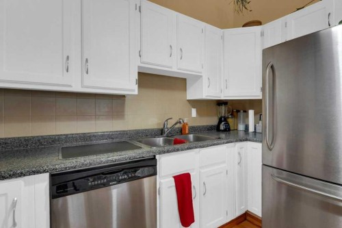 52 Strathclair Rise Sw, Calgary, AB - Indoor Photo Showing Kitchen With Double Sink