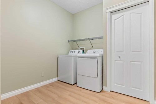 175 Sunset Close, Cochrane, AB - Indoor Photo Showing Laundry Room