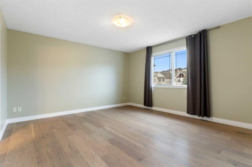 175 Sunset Close, Cochrane, AB - Indoor Photo Showing Other Room