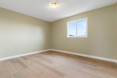 175 Sunset Close, Cochrane, AB - Indoor Photo Showing Other Room