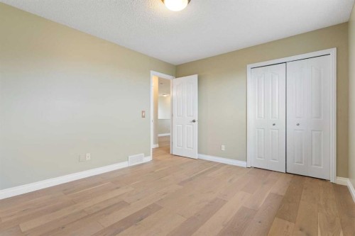 175 Sunset Close, Cochrane, AB - Indoor Photo Showing Other Room