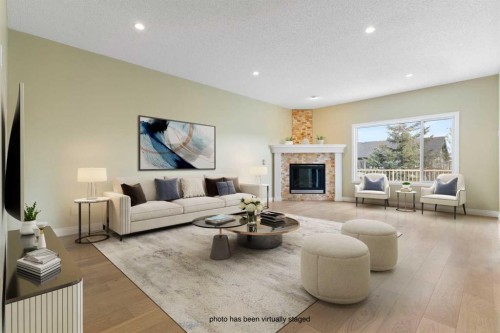 175 Sunset Close, Cochrane, AB - Indoor Photo Showing Living Room With Fireplace