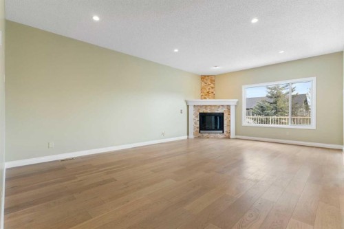 175 Sunset Close, Cochrane, AB - Indoor Photo Showing Living Room With Fireplace