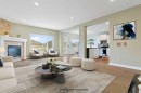 175 Sunset Close, Cochrane, AB  - Indoor Photo Showing Living Room With Fireplace 