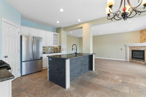 175 Sunset Close, Cochrane, AB - Indoor Photo Showing Kitchen With Upgraded Kitchen