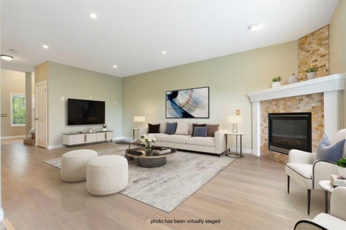 175 Sunset Close, Cochrane, AB - Indoor Photo Showing Living Room With Fireplace