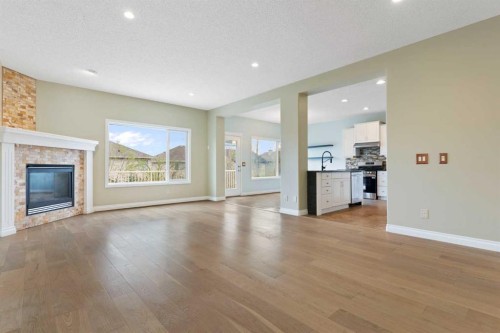 175 Sunset Close, Cochrane, AB - Indoor Photo Showing Living Room With Fireplace