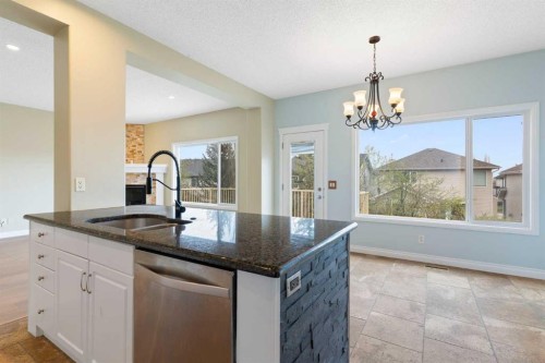175 Sunset Close, Cochrane, AB - Indoor Photo Showing Kitchen With Double Sink