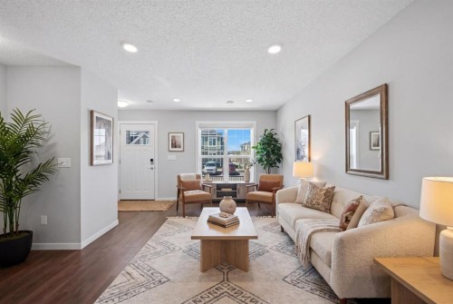 1322-7451 Falconridge Boulevard Ne, Calgary, AB - Indoor Photo Showing Living Room