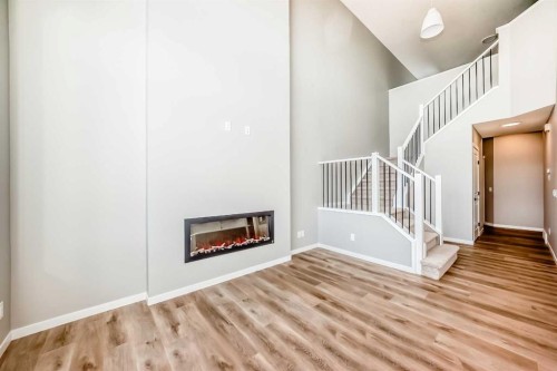 103 Mercado Crescent Se, Calgary, AB - Indoor Photo Showing Other Room With Fireplace
