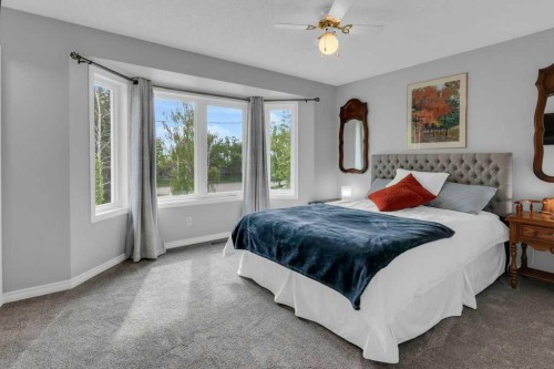 42 River Rock Green Se, Calgary, AB - Indoor Photo Showing Bedroom