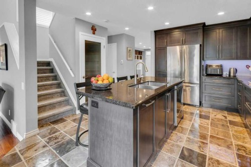 42 River Rock Green Se, Calgary, AB - Indoor Photo Showing Kitchen With Double Sink With Upgraded Kitchen