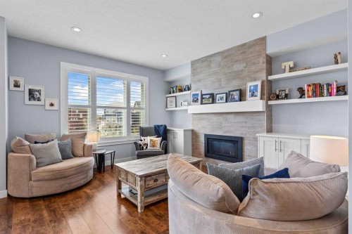 68 Legacy Manor Se, Calgary, AB - Indoor Photo Showing Living Room With Fireplace