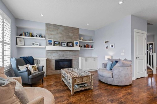 68 Legacy Manor Se, Calgary, AB - Indoor Photo Showing Living Room With Fireplace