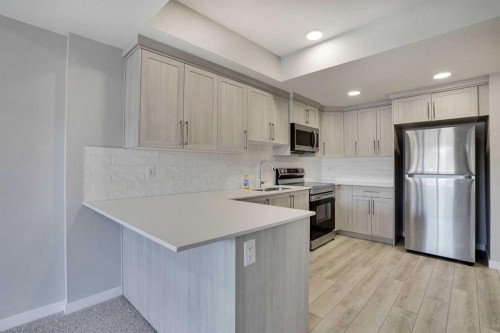 179 Lucas Heights Nw, Calgary, AB - Indoor Photo Showing Kitchen With Stainless Steel Kitchen With Double Sink