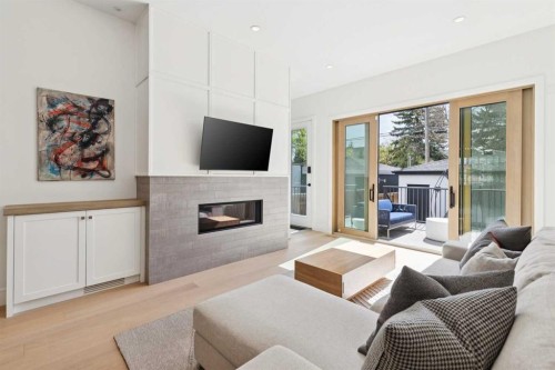 534 35A Street Nw, Calgary, AB - Indoor Photo Showing Living Room With Fireplace