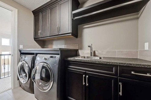 85 Rockcliff Heights Nw, Calgary, AB - Indoor Photo Showing Laundry Room