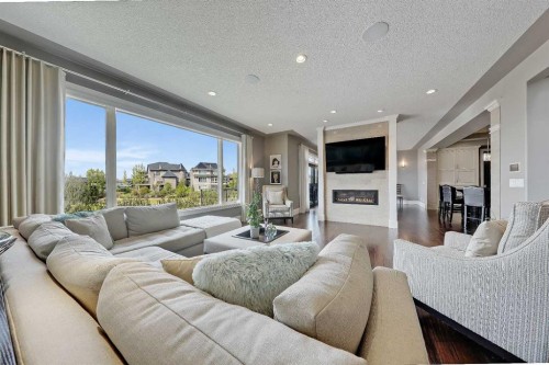 85 Rockcliff Heights Nw, Calgary, AB - Indoor Photo Showing Living Room With Fireplace