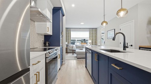 77 Wolf Gate, Okotoks, AB - Indoor Photo Showing Kitchen With Stainless Steel Kitchen With Upgraded Kitchen