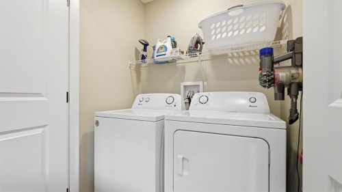 77 Wolf Gate, Okotoks, AB - Indoor Photo Showing Laundry Room