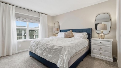 77 Wolf Gate, Okotoks, AB - Indoor Photo Showing Bedroom