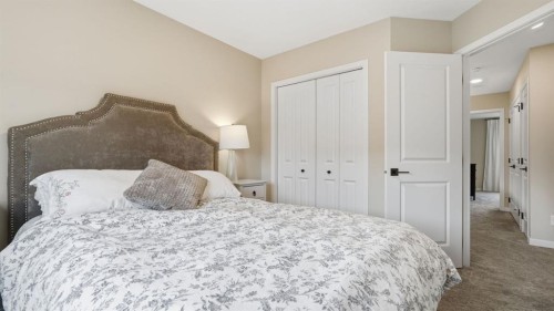 77 Wolf Gate, Okotoks, AB - Indoor Photo Showing Bedroom