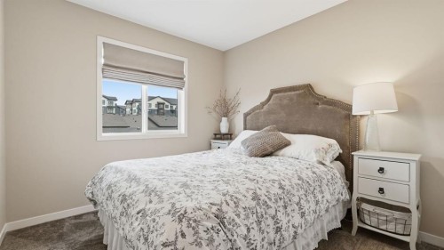 77 Wolf Gate, Okotoks, AB - Indoor Photo Showing Bedroom