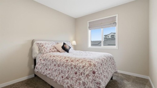 77 Wolf Gate, Okotoks, AB - Indoor Photo Showing Bedroom
