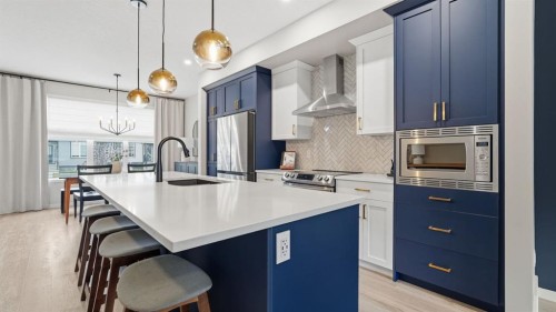 77 Wolf Gate, Okotoks, AB - Indoor Photo Showing Kitchen With Stainless Steel Kitchen With Upgraded Kitchen