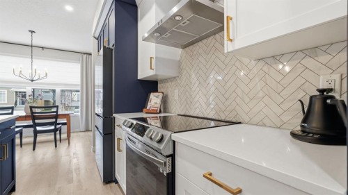 77 Wolf Gate, Okotoks, AB - Indoor Photo Showing Kitchen With Stainless Steel Kitchen
