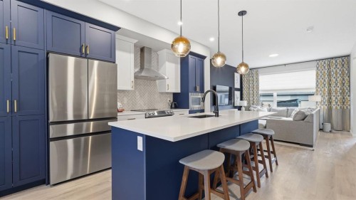 77 Wolf Gate, Okotoks, AB - Indoor Photo Showing Kitchen With Stainless Steel Kitchen With Upgraded Kitchen