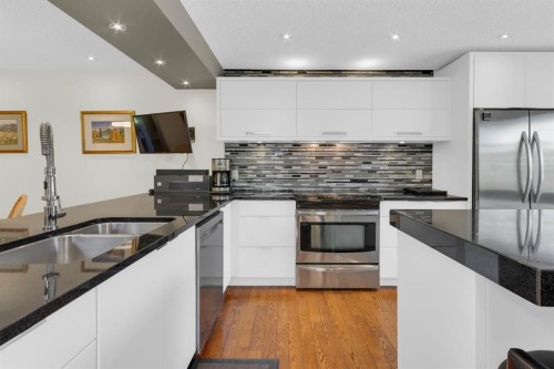 111 Point Drive Nw, Calgary, AB - Indoor Photo Showing Kitchen With Double Sink With Upgraded Kitchen
