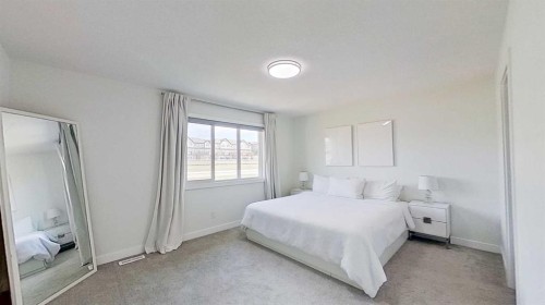 55 Belgian Crescent, Cochrane, AB - Indoor Photo Showing Bedroom