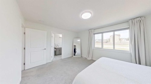 55 Belgian Crescent, Cochrane, AB - Indoor Photo Showing Bedroom