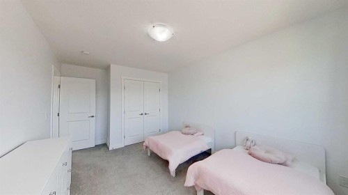 55 Belgian Crescent, Cochrane, AB - Indoor Photo Showing Bedroom