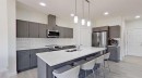 55 Belgian Crescent, Cochrane, AB  - Indoor Photo Showing Kitchen With Double Sink With Upgraded Kitchen 