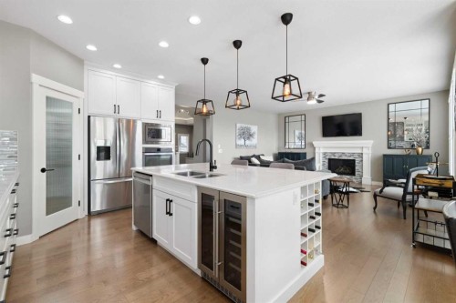 41 Banded Peak View, Okotoks, AB - Indoor Photo Showing Kitchen With Fireplace With Double Sink With Upgraded Kitchen
