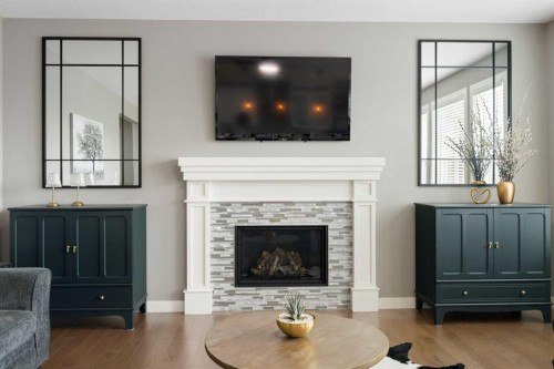 41 Banded Peak View, Okotoks, AB - Indoor Photo Showing Living Room With Fireplace