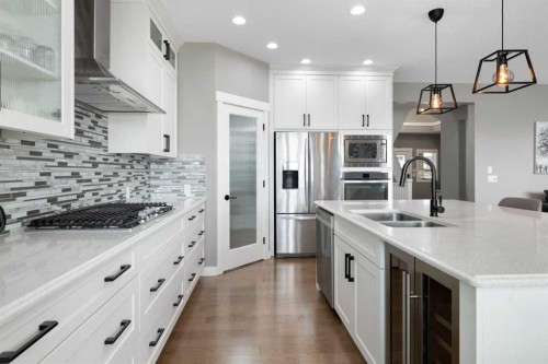 41 Banded Peak View, Okotoks, AB - Indoor Photo Showing Kitchen With Double Sink With Upgraded Kitchen
