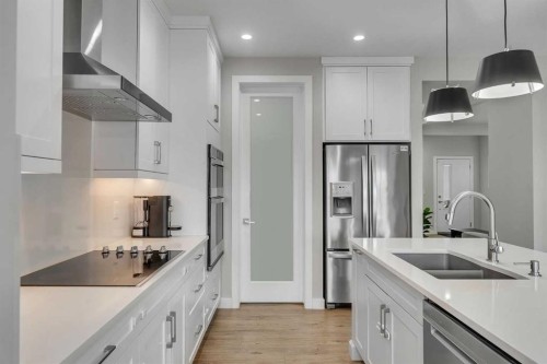 152 Savanna Way Ne, Calgary, AB - Indoor Photo Showing Kitchen With Double Sink With Upgraded Kitchen