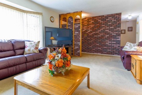 1444 Acadia Drive Se, Calgary, AB - Indoor Photo Showing Living Room