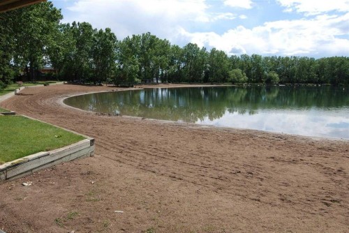 1444 Acadia Drive Se, Calgary, AB - Outdoor With Body Of Water